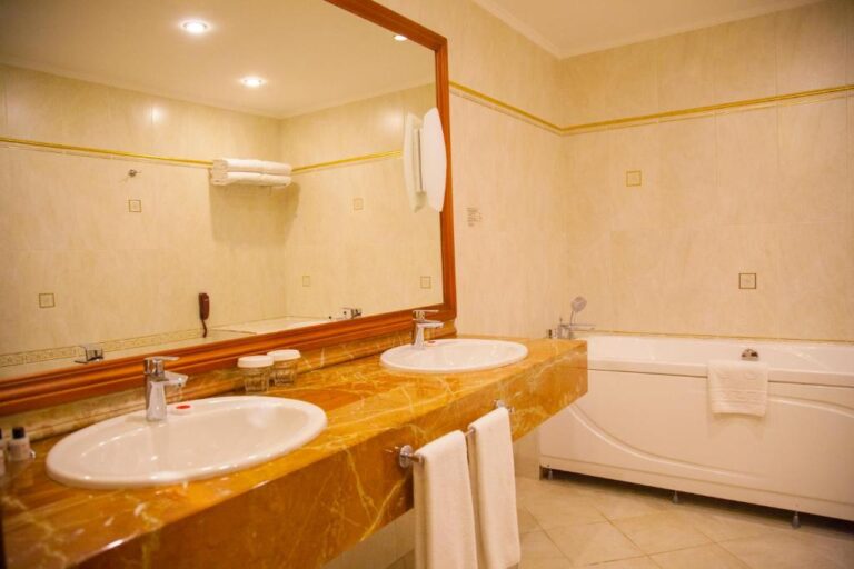 Bathroom of Apartment in Ramada Almaty