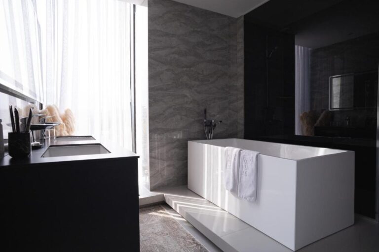 Bathroom of deluxe suite in Resident city Hotel
