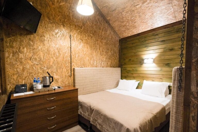 Bedroom of standard tree house in Oi-Qaragai Mountain Resort